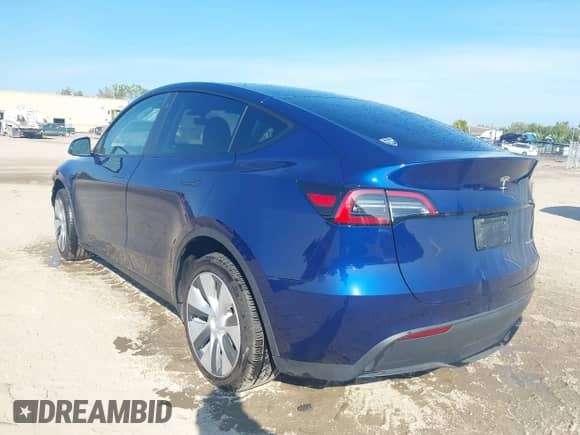 2023 Tesla Model Y Long Range with VIN 7SAYGDEE4PA125024, listed as a IAAI auction lot 43252218 with 21,200 mi miles and . Bid and sale history available at DreamBid. Image 3.