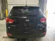 2012 Hyundai Tucson Limited z VIN KM8JUCAC2CU405336, wystawiony jako Copart lot #90353775 z przebiegiem 83 563 mil mil oraz Szkoda całkowita • Salvage title. Historia ofert i sprzedaży dostępna na DreamBid. Obrazek 6.