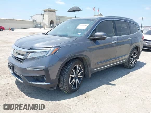 2020 Honda Pilot Touring 7-Passenger z VIN 5FNYF5H67LB021621, wystawiony jako IAAI lot #42446583 z przebiegiem 137 813 mil mil oraz . Historia ofert i sprzedaży dostępna na DreamBid. Obrazek 2.