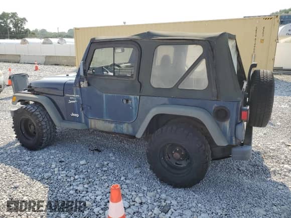2000 Jeep Wrangler Sport with VIN 1J4FA49S5YP744967, listed as a Copart auction lot 67909665 with 141,990 mi miles and Clean title. Bid and sale history available at DreamBid. Image 2.