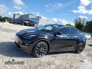 2023 Tesla Model Y Performance z VIN 7SAYGDEF0PF660573, wystawiony jako Copart lot #80920165 z przebiegiem 24 525 mil mil oraz Nie do naprawy • Non repairable. Historia ofert i sprzedaży dostępna na DreamBid. Obrazek 1.