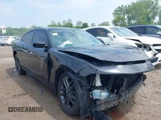 2019 Dodge Charger SXT with VIN 2C3CDXJG7KH710585, listed as a IAAI auction lot 42403270 with 115,869 mi miles and . Bid and sale history available at DreamBid. Image 1.