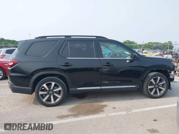 2023 Honda Pilot Elite with VIN 5FNYG1H81PB050321, listed as a IAAI auction lot 42346325 with 13,201 mi miles and . Bid and sale history available at DreamBid. Image 14.