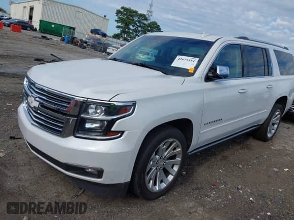 2019 Chevrolet Suburban Premier with VIN 1GNSCJKC9KR126778, listed as a IAAI auction lot 42675554 with 164,489 mi miles and . Bid and sale history available at DreamBid. Image 2.