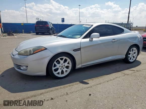 2008 Hyundai Tiburon GT с VIN KMHHN66F78U271320, выставлен на аукционе Copart как лот 70542895 с пробегом 156 109 миль миль и Списание • Salvage title. История ставок и продаж доступна на DreamBid. Изображение 1.