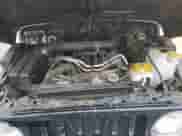 2002 Jeep Wrangler Sahara with VIN 1J4FA59SX2P747327, listed as a Copart auction lot 59515455 with 79,964 mi miles and Salvage title. Bid and sale history available at DreamBid. Image 11.