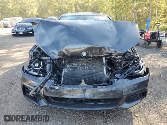 2018 BMW 5 Series 530i xDrive z VIN WBAJA7C52JWC75174, wystawiony jako Copart lot #70750925 z przebiegiem 115 010 mil mil oraz Szkoda całkowita • Salvage title. Historia ofert i sprzedaży dostępna na DreamBid. Obrazek 5.