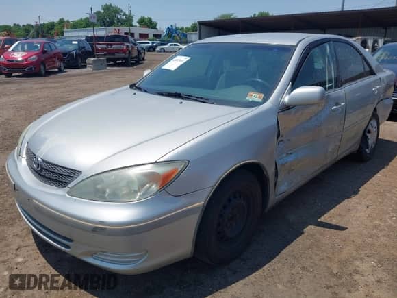2004 Toyota Camry LE with VIN 4T1BE32KX4U865711, listed as a IAAI auction lot 42482401 with 111,082 mi miles and . Bid and sale history available at DreamBid. Image 2.