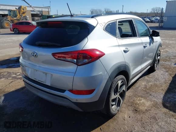2017 Hyundai Tucson Sport with VIN KM8J33A21HU580324, listed as a IAAI auction lot 41651502 with 128,435 mi miles and . Bid and sale history available at DreamBid. Image 4.