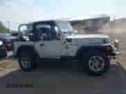 1998 Jeep Wrangler SE z VIN 1J4FY29P5WP797211, wystawiony jako IAAI lot #42972127 z przebiegiem 123 163 mil mil oraz . Historia ofert i sprzedaży dostępna na DreamBid. Obrazek 14.