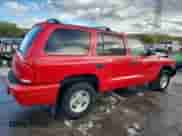 1999 Dodge Durango with VIN 1B4HS28Y8XF665252, listed as a Copart auction lot 84897495 with 173,078 mi miles and Salvage title. Bid and sale history available at DreamBid. Image 3.