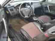2005 Hyundai Tiburon GT с VIN KMHHN65F95U159244, выставлен на аукционе Copart как лот 76318134 с пробегом 78 324 миль миль и Чистый • Clean title. История ставок и продаж доступна на DreamBid. Изображение 8.