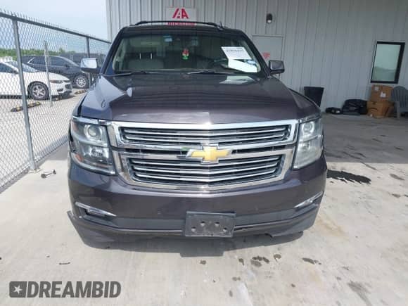 2015 Chevrolet Suburban LTZ z VIN 1GNSCKKCXFR627304, wystawiony jako IAAI lot #42826425 z przebiegiem 137 294 mil mil oraz . Historia ofert i sprzedaży dostępna na DreamBid. Obrazek 12.