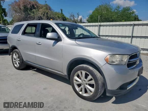 2012 Dodge Durango SXT with VIN 1C4RDHAG5CC321718, listed as a Copart auction lot 68470685 with 117,403 mi miles and Salvage title. Bid and sale history available at DreamBid. Image 4.