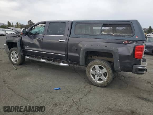2015 Chevrolet Silverado 2500HD LTZ with VIN 1GC1KWE88FF616678, listed as a Copart auction lot 81795515 with 136,597 mi miles and Salvage title. Bid and sale history available at DreamBid. Image 2.