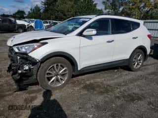 2015 Hyundai Santa Fe z VIN 5XYZUDLA4FG261139, wystawiony jako Copart lot #86995445 z przebiegiem 90 078 mil mil oraz Szkoda całkowita • Salvage title. Historia ofert i sprzedaży dostępna na DreamBid. Obrazek 1.