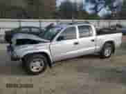 2003 Dodge Dakota Sport with VIN 1D7HL38X13S366321, listed as a Copart auction lot 79310814 with 314,577 mi miles and Salvage title. Bid and sale history available at DreamBid. Image 1.