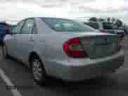 2002 Toyota Camry LE with VIN 4T1BE30K22U601060, listed as a IAAI auction lot 43443949 with 241,972 mi miles and . Bid and sale history available at DreamBid. Image 3.