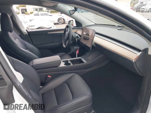 2023 Tesla Model Y Long Range with VIN 7SAYGAEE2PF763662, listed as a IAAI auction lot 43412618 with 43,857 mi miles and . Bid and sale history available at DreamBid. Image 5.