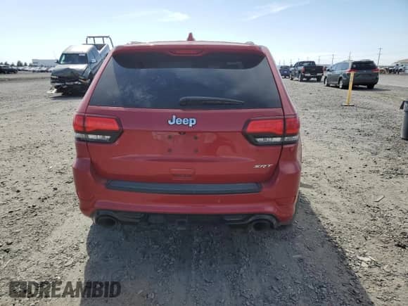 2014 Jeep Grand Cherokee SRT-8 z VIN 1C4RJFDJ5EC340647, wystawiony jako Copart lot #62144645 z przebiegiem Nie podano mil oraz Czysty tytuł • Clean title. Historia ofert i sprzedaży dostępna na DreamBid. Obrazek 6.