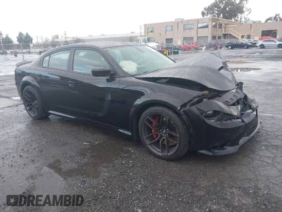 2021 Dodge Charger Scat Pack Widebody with VIN 2C3CDXGJ9MH561070, listed as a IAAI auction lot 41798863 with 62,984 mi miles and . Bid and sale history available at DreamBid. Image 1.