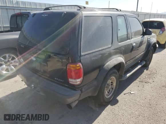 1998 Ford Explorer with VIN 1FMYU22E0WUD43223, listed as a Copart auction lot 64430825 with 180,159 mi miles and Salvage title. Bid and sale history available at DreamBid. Image 3.