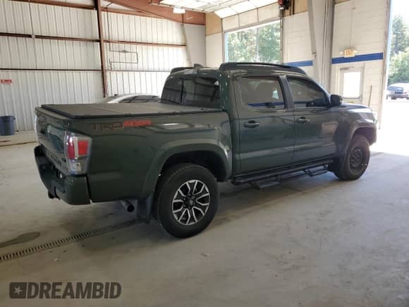 2022 Toyota Tacoma TRD Off Road z VIN 3TMCZ5AN0NM489305, wystawiony jako Copart lot #85562145 z przebiegiem 63 902 mil mil oraz Szkoda całkowita • Salvage title. Historia ofert i sprzedaży dostępna na DreamBid. Obrazek 3.