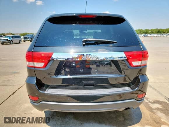 2012 Jeep Grand Cherokee Laredo z VIN 1C4RJEAG4CC258909, wystawiony jako Copart lot #70101885 z przebiegiem 168 332 mil mil oraz Czysty tytuł • Clean title. Historia ofert i sprzedaży dostępna na DreamBid. Obrazek 6.
