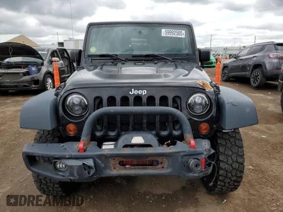 2013 Jeep Wrangler Rubicon 10th Anniversary with VIN 1C4BJWCG7DL677164, listed as a Copart auction lot 59992505 with 120,000 mi miles and Salvage title. Bid and sale history available at DreamBid. Image 5.