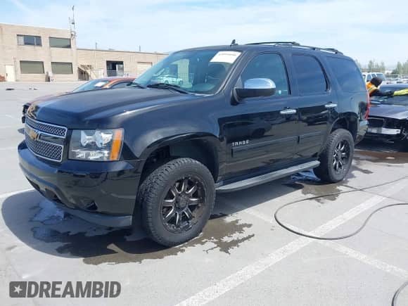 2013 Chevrolet Tahoe LS with VIN 1GNSKAE07DR355208, listed as a IAAI auction lot 42095090 with 159,409 mi miles and . Bid and sale history available at DreamBid. Image 2.