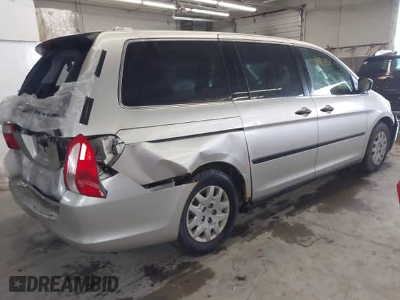 2007 Honda Odyssey LX z VIN 5FNRL38217B042128, wystawiony jako IAAI lot #43479801 z przebiegiem 162 428 mil mil oraz . Historia ofert i sprzedaży dostępna na DreamBid. Obrazek 4.