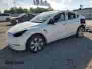 2022 Tesla Model Y Long Range с VIN 7SAYGDEE4NF339544, выставлен на аукционе Copart как лот 84565635 с пробегом 54 231 миль миль и Списание • Salvage title. История ставок и продаж доступна на DreamBid. Изображение 1.