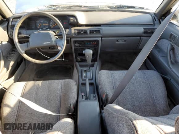1990 Toyota Camry z VIN 4T1VV21EXLU008760, wystawiony jako Copart lot #88344665 z przebiegiem 154 971 mil mil oraz Nie do naprawy • Non repairable. Historia ofert i sprzedaży dostępna na DreamBid. Obrazek 8.