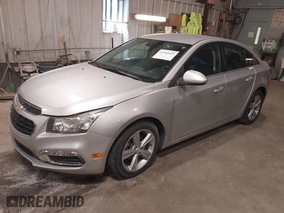 2015 Chevrolet Cruze LT with VIN 1G1PE5SB9F7159247, listed as a IAAI auction lot 42701023 with 118,698 mi miles and . Bid and sale history available at DreamBid. Image 2.