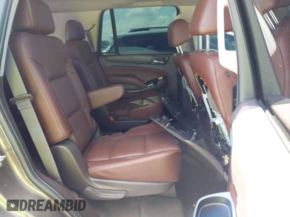 2015 Chevrolet Tahoe LTZ with VIN 1GNSCCKC1FR599320, listed as a IAAI auction lot 43093837 with 124,751 mi miles and . Bid and sale history available at DreamBid. Image 8.