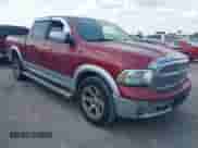 2014 Ram 1500 Laramie with VIN 1C6RR6NT0ES314947, listed as a IAAI auction lot 42934662 with 195,174 mi miles and . Bid and sale history available at DreamBid. Image 1.