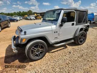 2004 Jeep Wrangler X with VIN 1J4FA39S34P798854, listed as a Copart auction lot 71769025 with 167,178 mi miles and Salvage title. Bid and sale history available at DreamBid. Image 1.