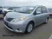 2011 Toyota Sienna XLE with VIN 5TDYK3DC7BS006817, listed as a IAAI auction lot 43410453 with 151,210 mi miles and . Bid and sale history available at DreamBid. Image 2.