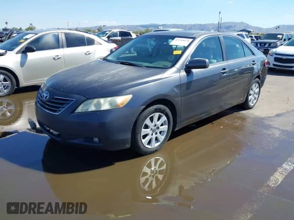2007 Toyota Camry LE with VIN 4T1BK46K07U032299, listed as a IAAI auction lot 43320070 with 186,121 mi miles and . Bid and sale history available at DreamBid. Image 2.
