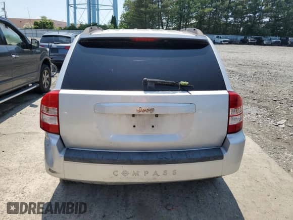 2007 Jeep Compass Sport with VIN 1J8FT47W87D158424, listed as a Copart auction lot 61333865 with 243,861 mi miles and Salvage title. Bid and sale history available at DreamBid. Image 6.