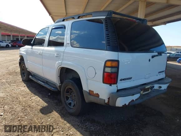 2005 Chevrolet Tahoe LS with VIN 1GNEK13T25R156837, listed as a IAAI auction lot 43254559 with 200,636 mi miles and . Bid and sale history available at DreamBid. Image 3.