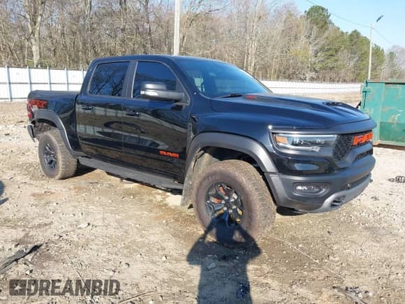 2021 Ram 1500 TRX с VIN 1C6SRFU99MN758770, выставлен на аукционе IAAI как лот 38873371 с пробегом 59 097 миль миль и . История ставок и продаж доступна на DreamBid. Изображение 1.