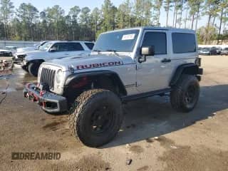 2016 Jeep Wrangler Rubicon with VIN 1C4BJWCG0GL170403, listed as a Copart auction lot 44132165 with 124,557 mi miles and Salvage title. Bid and sale history available at DreamBid. Image 1.