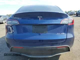 2023 Tesla Model Y Long Range with VIN 7SAYGDEE5PF910400, listed as a Copart auction lot 66009544 with 5,117 mi miles and Salvage title. Bid and sale history available at DreamBid. Image 6.