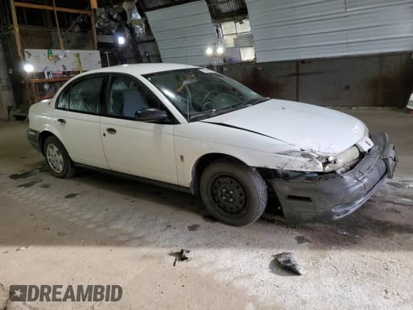 1999 Saturn SL with VIN 1G8ZH528XXZ235067, listed as a Copart auction lot 74508564 with 155,180 mi miles and Salvage title. Bid and sale history available at DreamBid. Image 4.