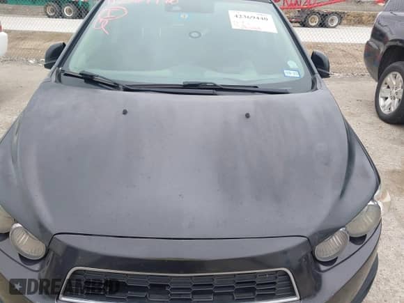 2014 Chevrolet Sonic LT with VIN 1G1JC6SB9E4234627, listed as a IAAI auction lot 42369440 with 63,098 mi miles and . Bid and sale history available at DreamBid. Image 6.