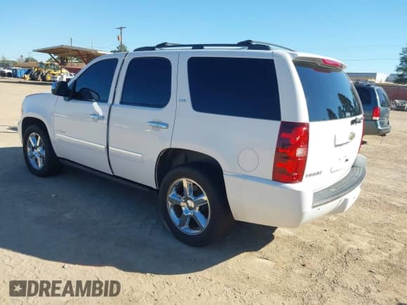 2011 Chevrolet Tahoe LTZ with VIN 1GNSCCE00BR252170, listed as a IAAI auction lot 43480102 with 201,291 mi miles and . Bid and sale history available at DreamBid. Image 3.