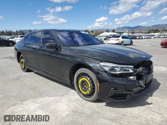2018 BMW 7 Series 750i with VIN WBA7F0C5XJGM23016, listed as a Copart auction lot 51284255 with 69,460 mi miles and Salvage title. Bid and sale history available at DreamBid. Image 4.