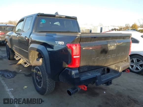 2024 Toyota Tacoma SR5 with VIN 3TYLB5JN3RT032583, listed as a IAAI auction lot 41404527 with 7,130 mi miles and . Bid and sale history available at DreamBid. Image 3.