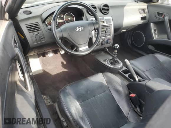 2004 Hyundai Tiburon GT with VIN KMHHN65F54U112663, listed as a Copart auction lot 60543975 with 51,589 mi miles and Salvage title. Bid and sale history available at DreamBid. Image 8.